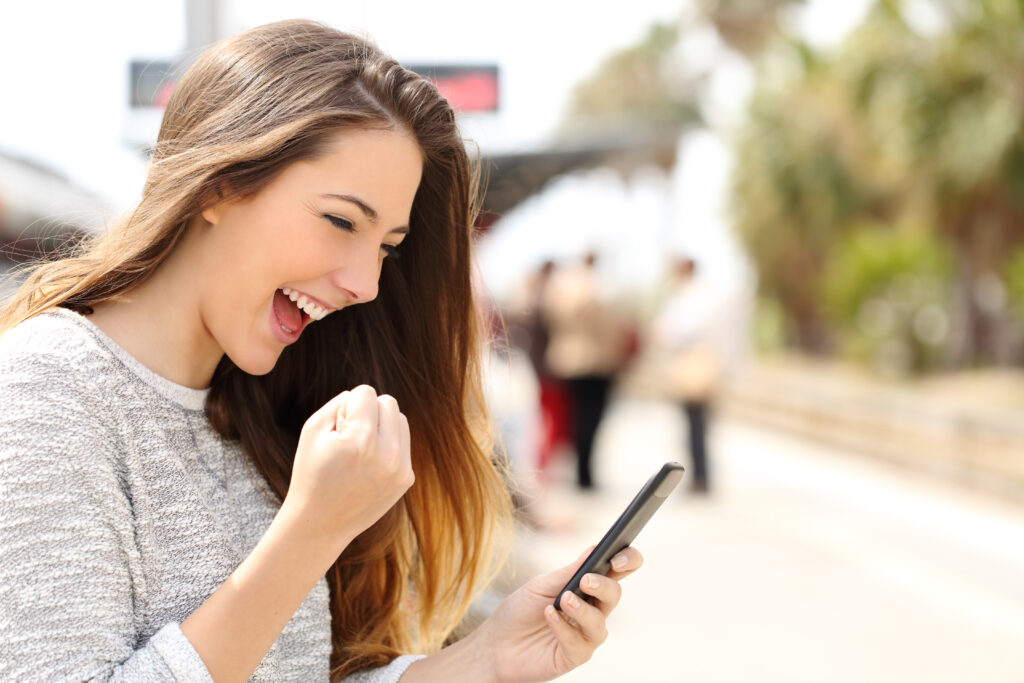 woman winning game on phone